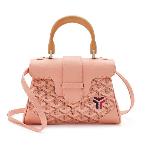 pink mini goyard bag.